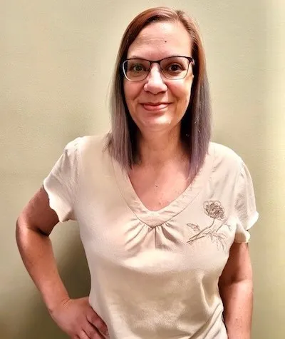 Headshot of Trish, our Assistant, smiling in the office